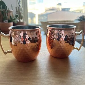 Moscow mule copper mugs with gold accent. Never used. Comes in pair of 2